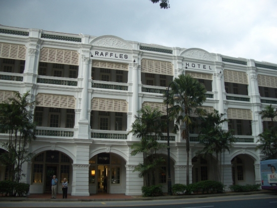 Man Uses Toothpick Outside Raffles While Wife Looks On